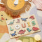 Puzzle prénom en bois personnalisé décor dinosaures, prénom Louis en lettres pastel